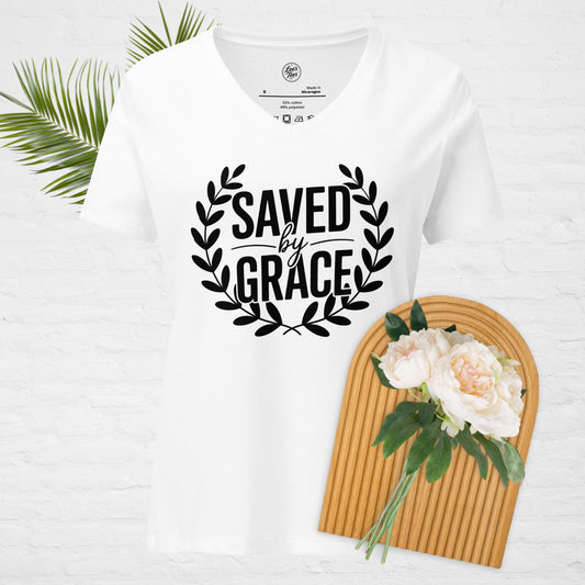 A white v-neck t-shirt with "Saved by Grace" in a wreath design.